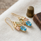 Oval Blue Topaz Earrings, 10k Yellow Gold, 12k Green and Rose Gold Black Hills Gold Motif