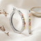 Tri-Color Openwork Scroll Oval Hoop Earrings in Sterling Silver with 12k Green and Rose Gold Leaves, Black Hills Gold Botanical Jewelry for Women with Hinged Closures