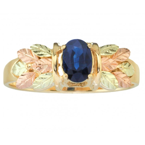 Ave 369 .53 Faceted Oval Sapphire 10k Yellow Gold with a Bouquet of 12k Green and Rose Gold Black Hills Gold Hand Sculpted Leaves